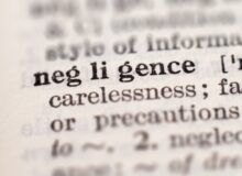 Dictionary definition of word negligence, selective focus. Concept of what are the four types of negligence