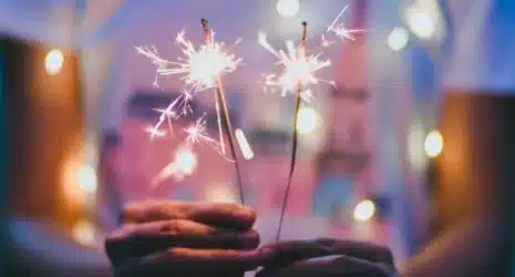 Teenage girl holding a fireworks.