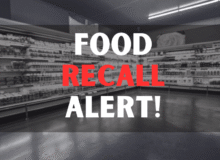 Defocused blur buying milk put on shelf in supermarket with food recall texts.