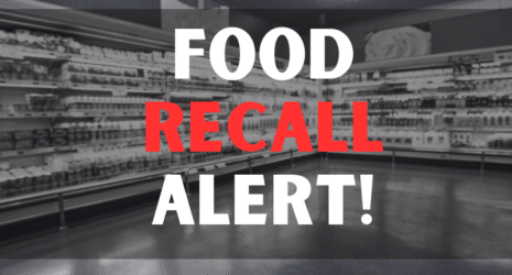 Defocused blur buying milk put on shelf in supermarket with food recall texts.