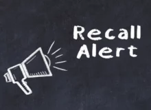 Chalk board sketch with loudspeaker and a recall alert phrase.